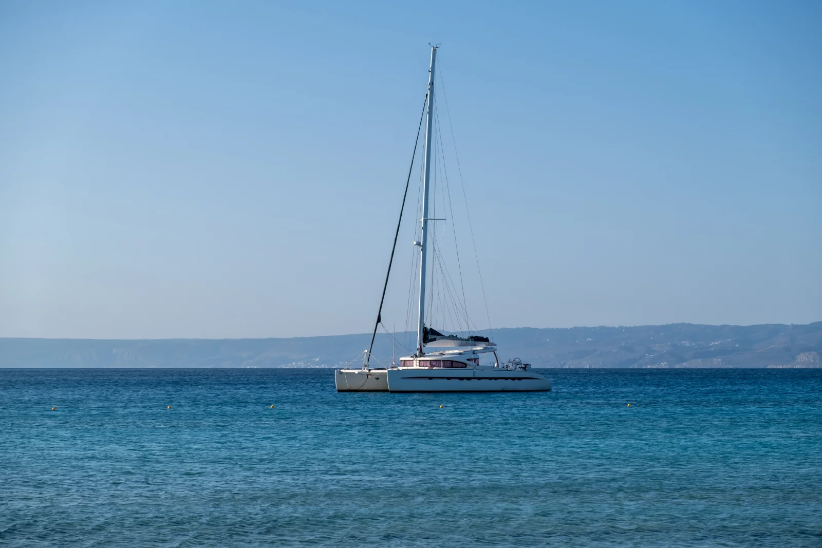 sailing boat catamaran anchored at rippled sea la 2024 12 07 22 07 06 utc